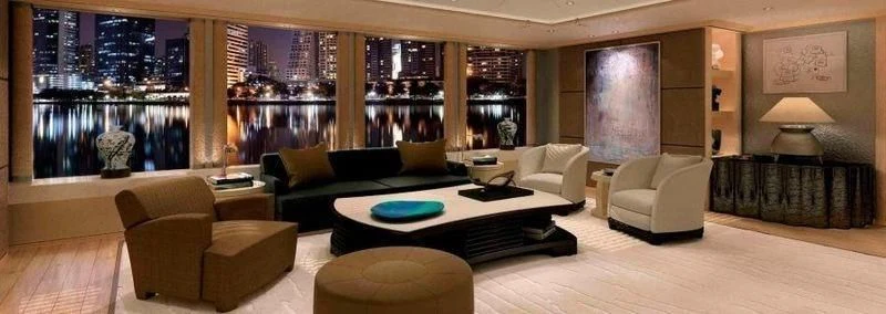 a large room with a couch and a table aboard SHODAN Yacht for Sale