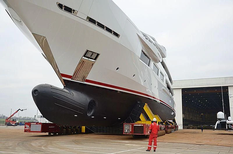 a person standing next to a large space ship aboard SHODAN Yacht for Sale