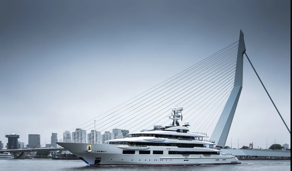 a large white boat in a harbor aboard SHODAN Yacht for Sale