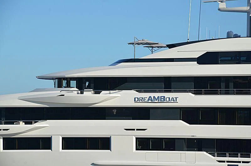 a plane flying over a building aboard SHODAN Yacht for Sale
