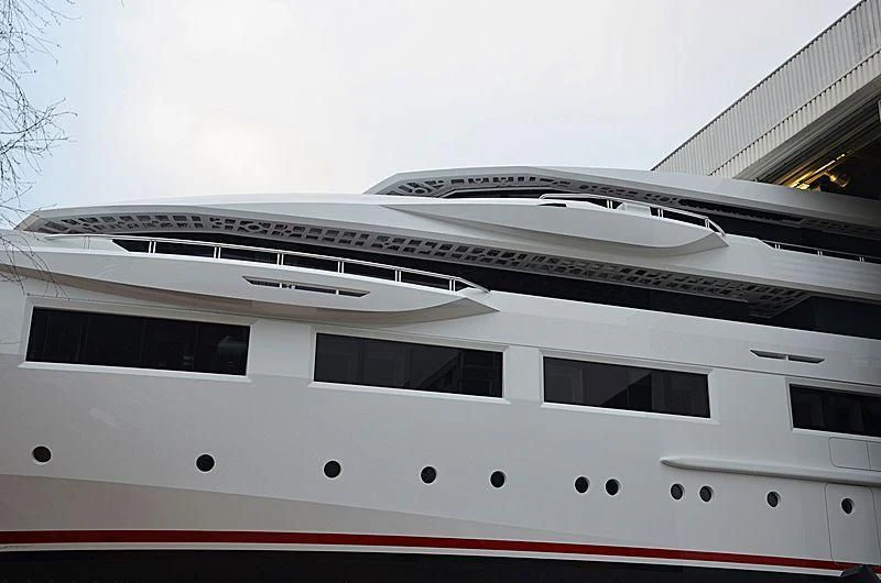 a white building with a red and white striped roof aboard SHODAN Yacht for Sale