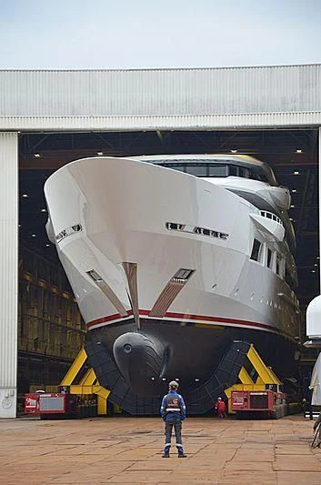 a person standing next to a large space ship aboard SHODAN Yacht for Sale