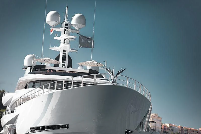 a large white boat with a satellite dish on top aboard SHODAN Yacht for Sale