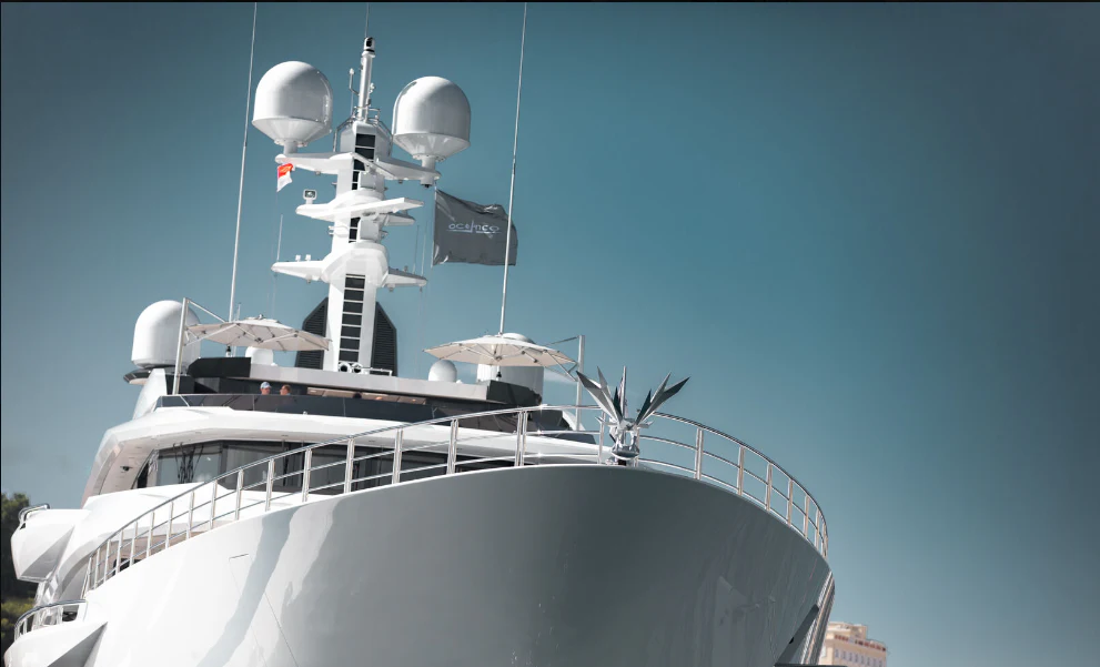 a large white ship with a satellite dish on top aboard SHODAN Yacht for Sale