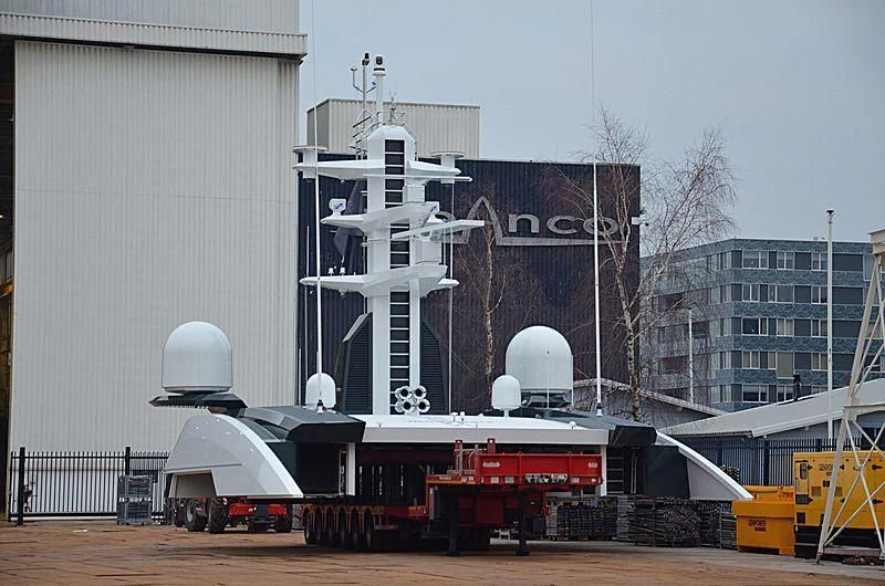 a large white ship docked aboard SHODAN Yacht for Sale