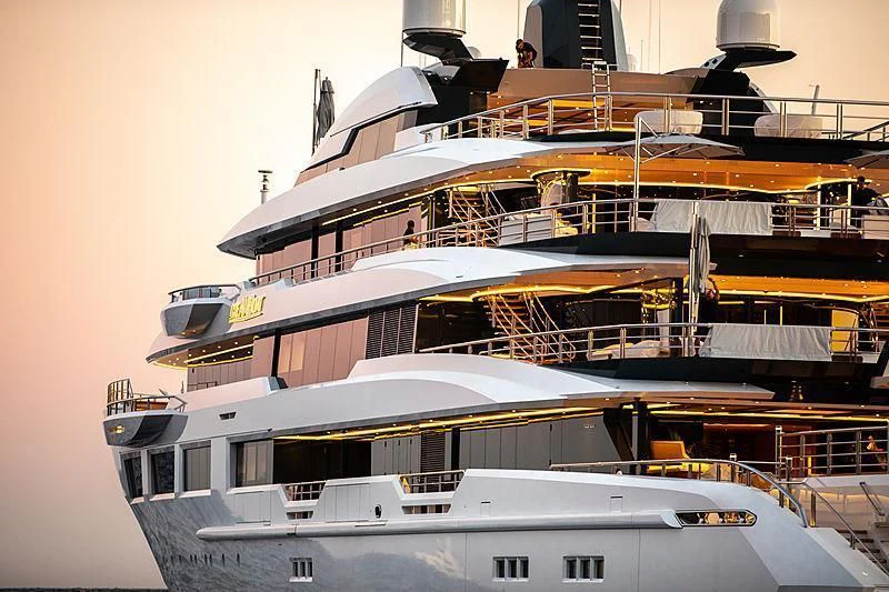 a large cruise ship docked aboard SHODAN Yacht for Sale