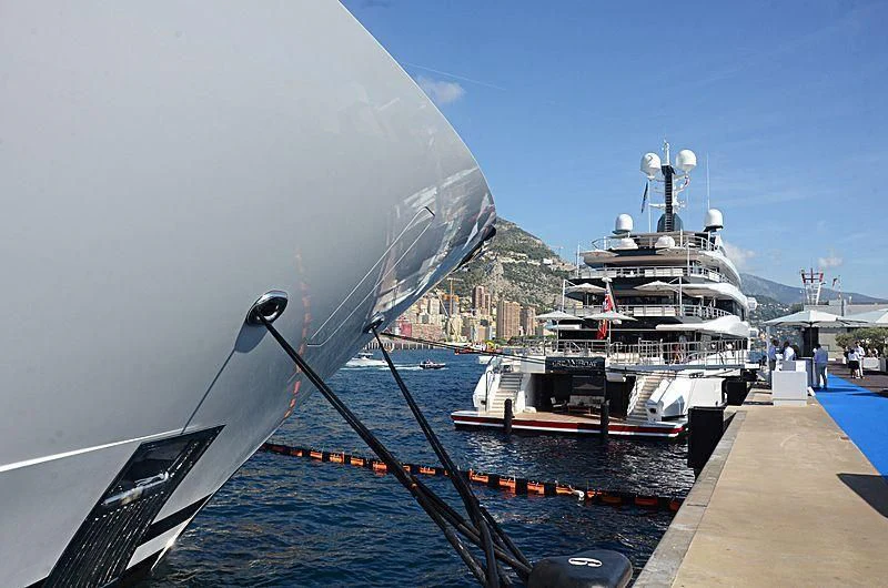 a large ship docked at a pier aboard SHODAN Yacht for Sale