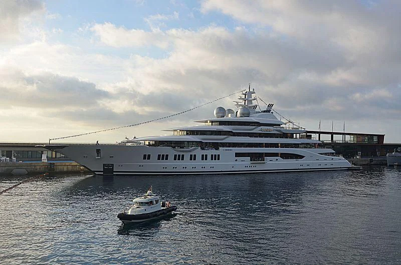a large white ship docked aboard SHODAN Yacht for Sale