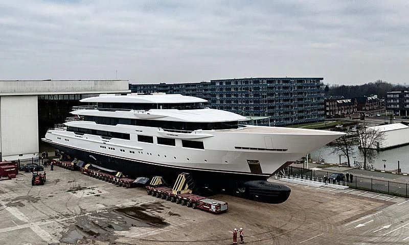 a large cruise ship docked aboard SHODAN Yacht for Sale