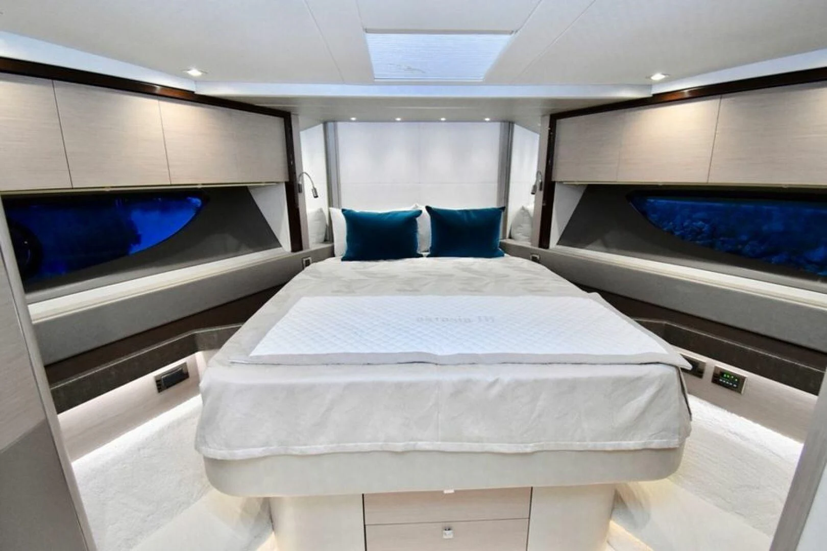 a room with beds and a window aboard DO IT ANYWAY Yacht for Sale