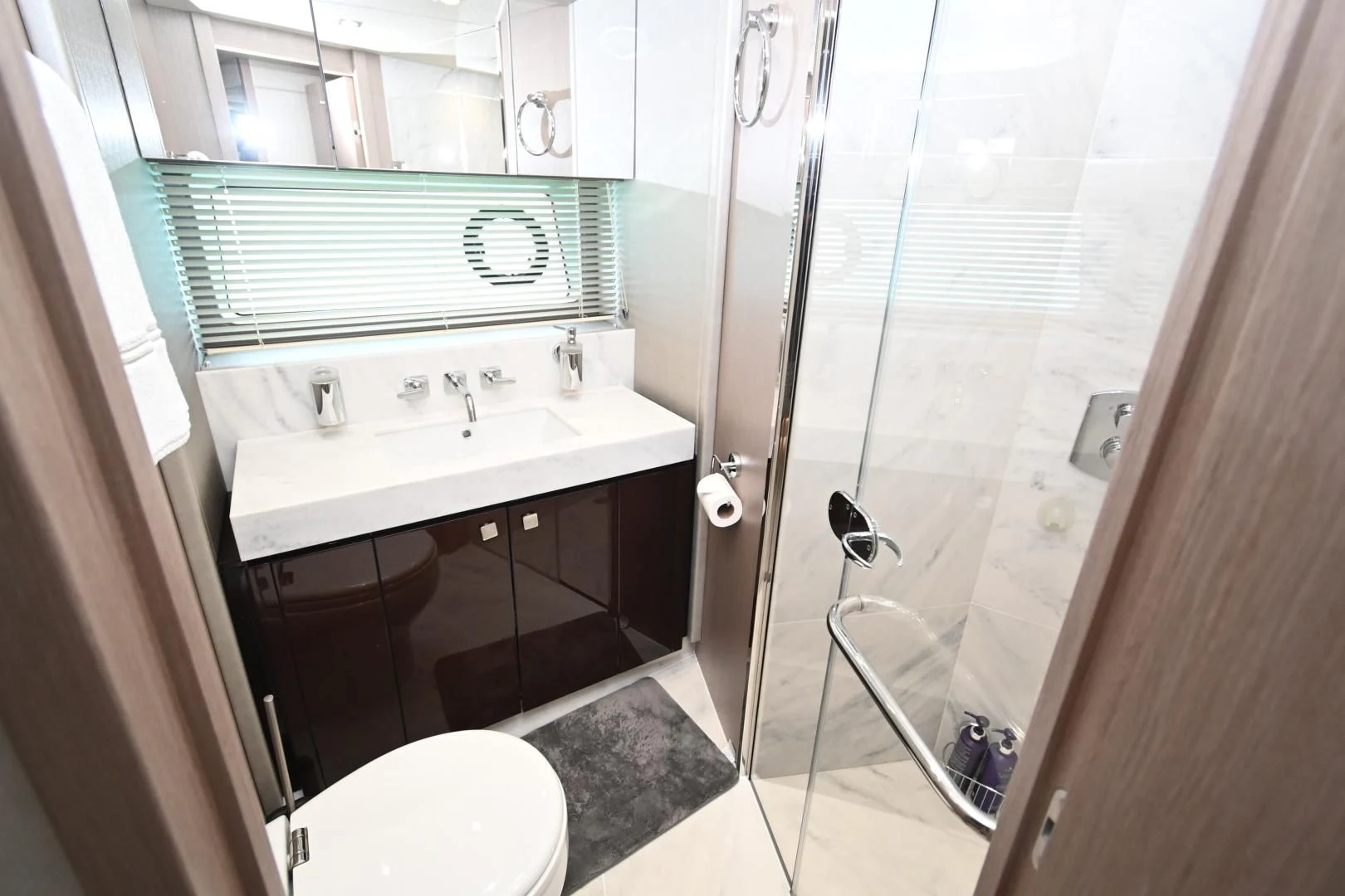 a bathroom with a glass shower aboard DO IT ANYWAY Yacht for Sale