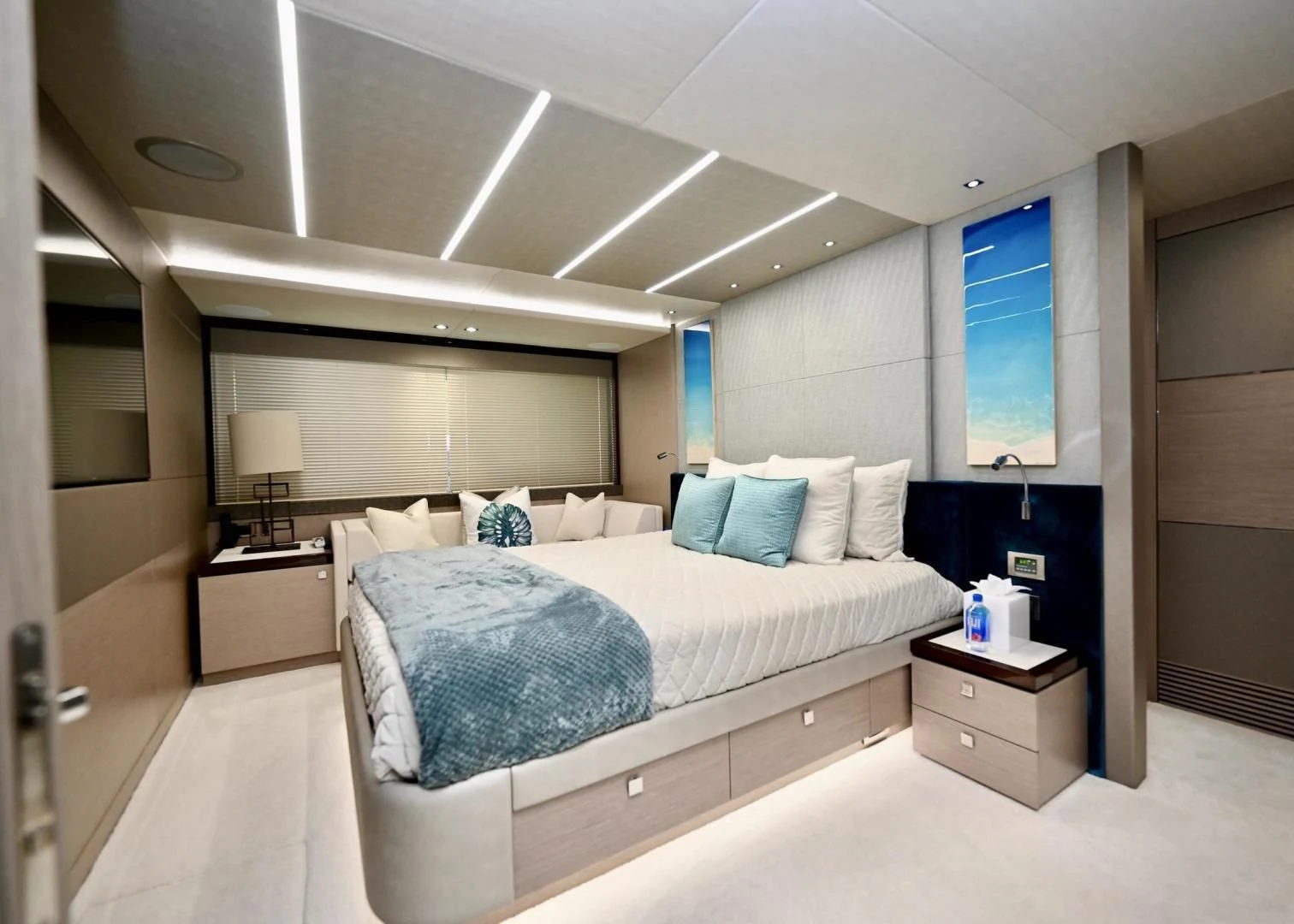 a bedroom with a bed and a desk aboard DO IT ANYWAY Yacht for Sale