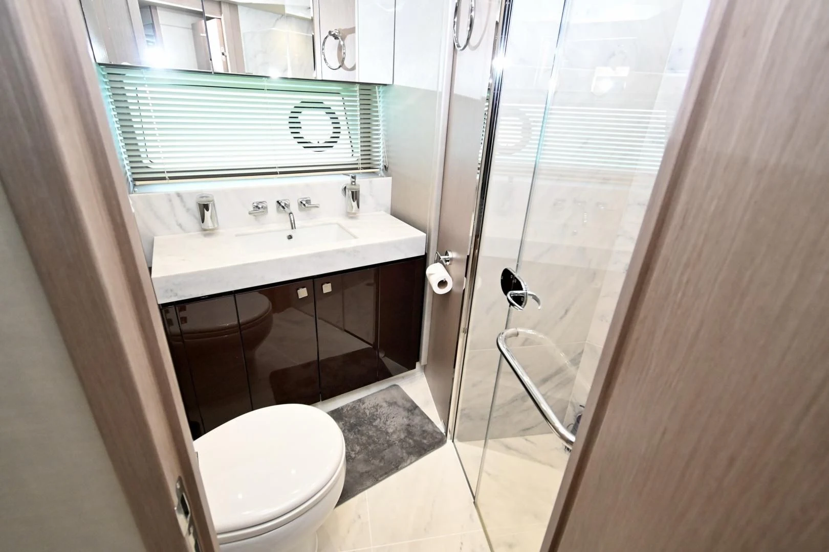 a bathroom with a sink and a shower aboard DO IT ANYWAY Yacht for Sale