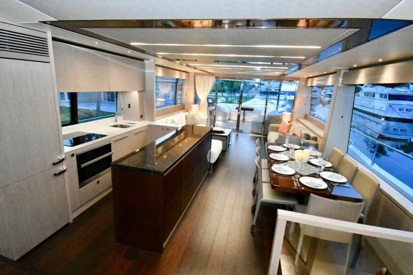 a kitchen with a table and chairs aboard DO IT ANYWAY Yacht for Sale