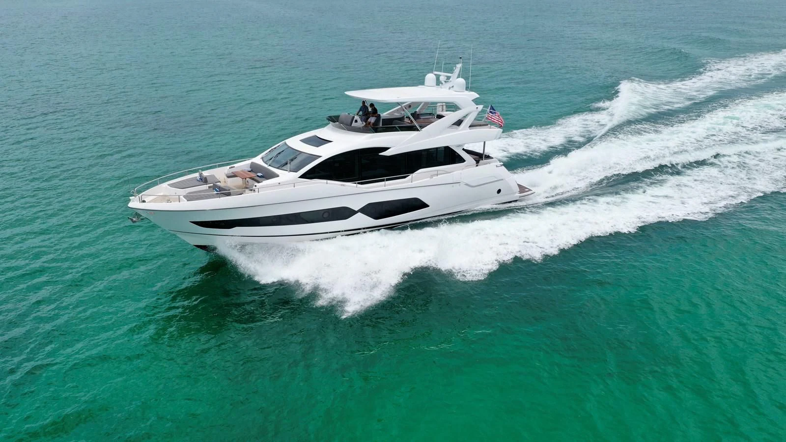 a white boat on the water aboard DO IT ANYWAY Yacht for Sale