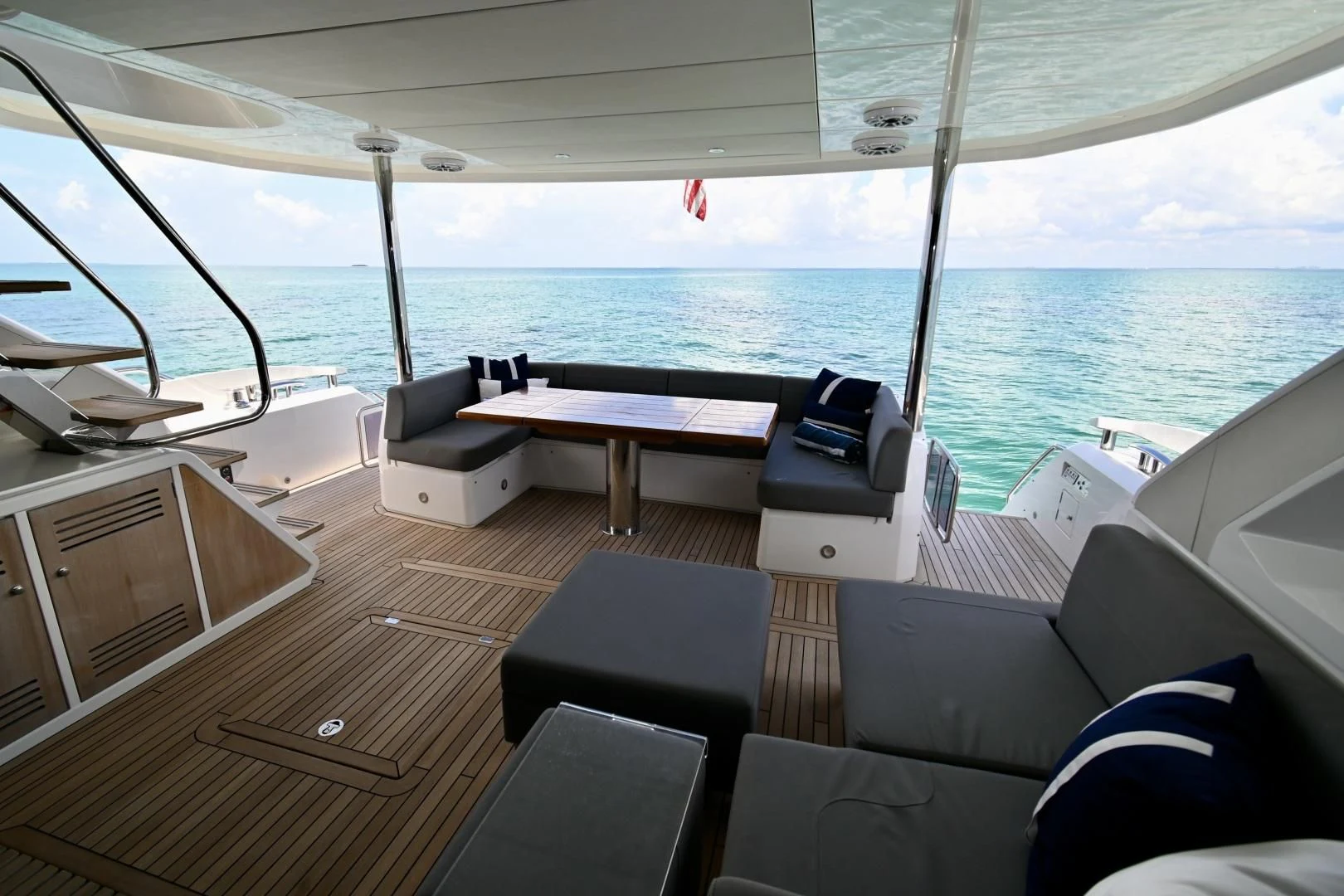 a boat with a table and chairs on it aboard DO IT ANYWAY Yacht for Sale