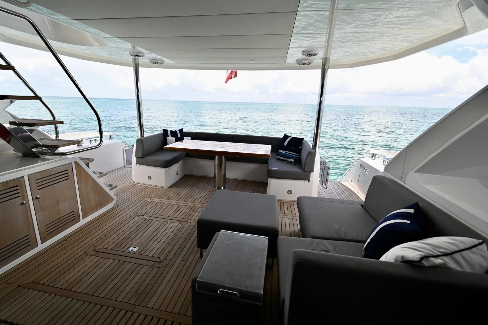 a boat with a table and chairs on the deck aboard DO IT ANYWAY Yacht for Sale