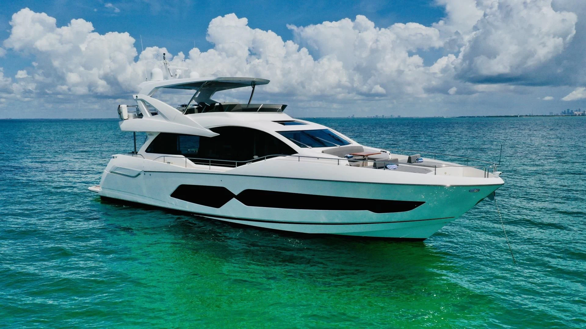 a white yacht in the ocean aboard DO IT ANYWAY Yacht for Sale