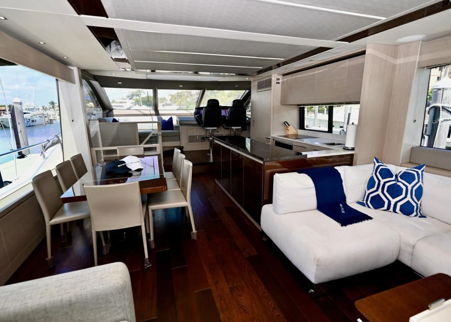 a large room with a table and chairs aboard DO IT ANYWAY Yacht for Sale