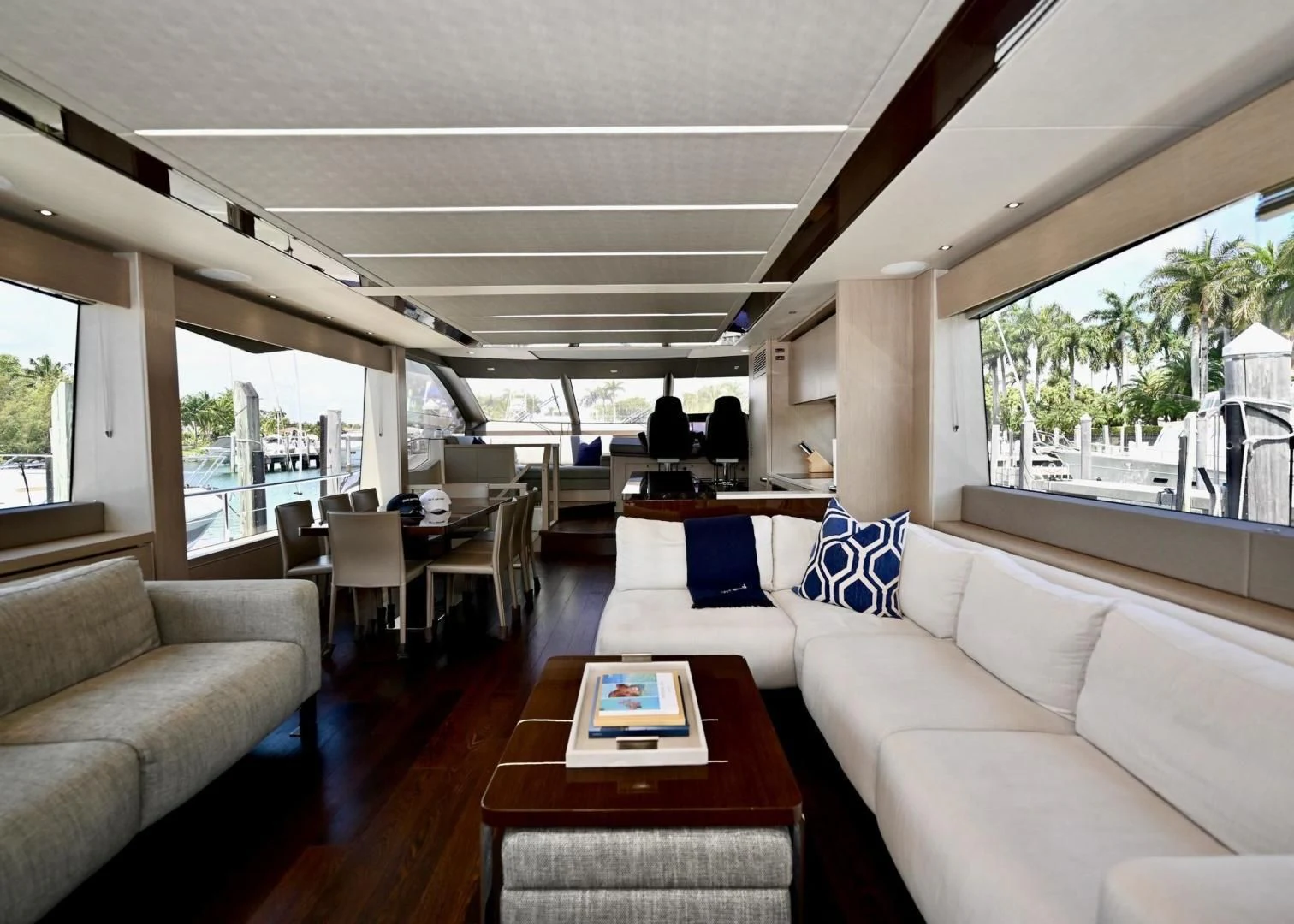 a living room with a table and couches aboard DO IT ANYWAY Yacht for Sale