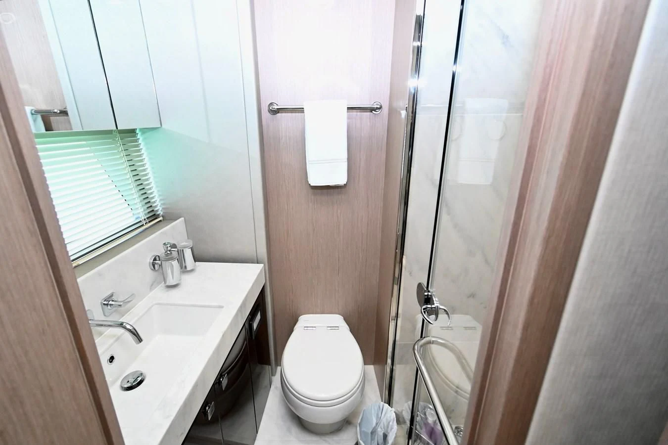 a bathroom with a toilet sink and a shower unit aboard DO IT ANYWAY Yacht for Sale