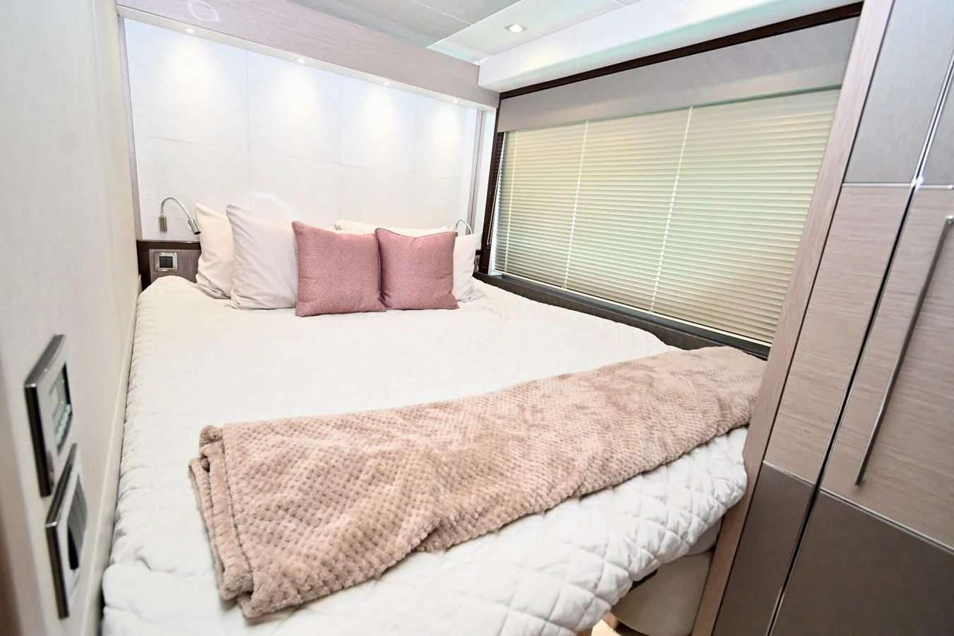 a bed with pink pillows aboard DO IT ANYWAY Yacht for Sale