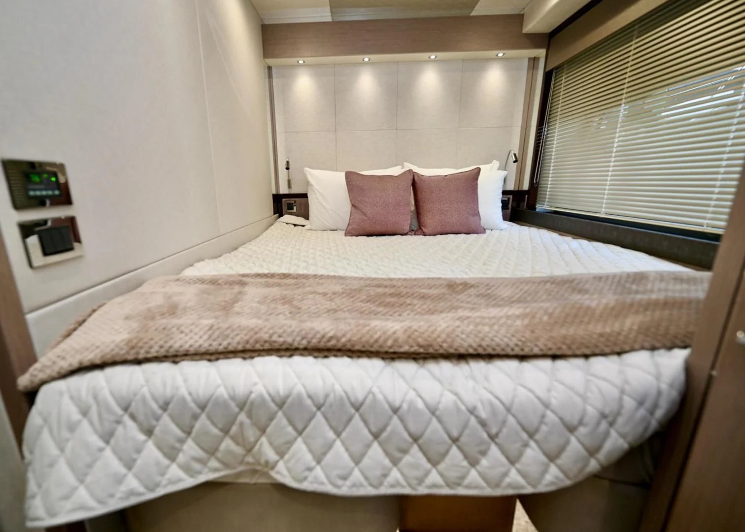 a bed with pink pillows aboard DO IT ANYWAY Yacht for Sale