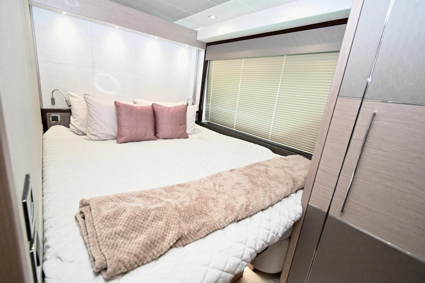 a bed with pink pillows aboard DO IT ANYWAY Yacht for Sale