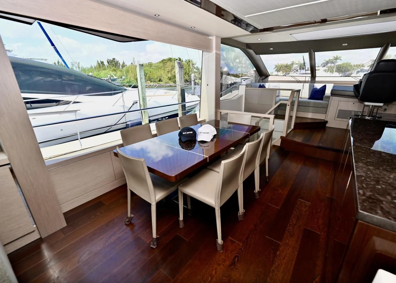 a table and chairs on a deck aboard DO IT ANYWAY Yacht for Sale