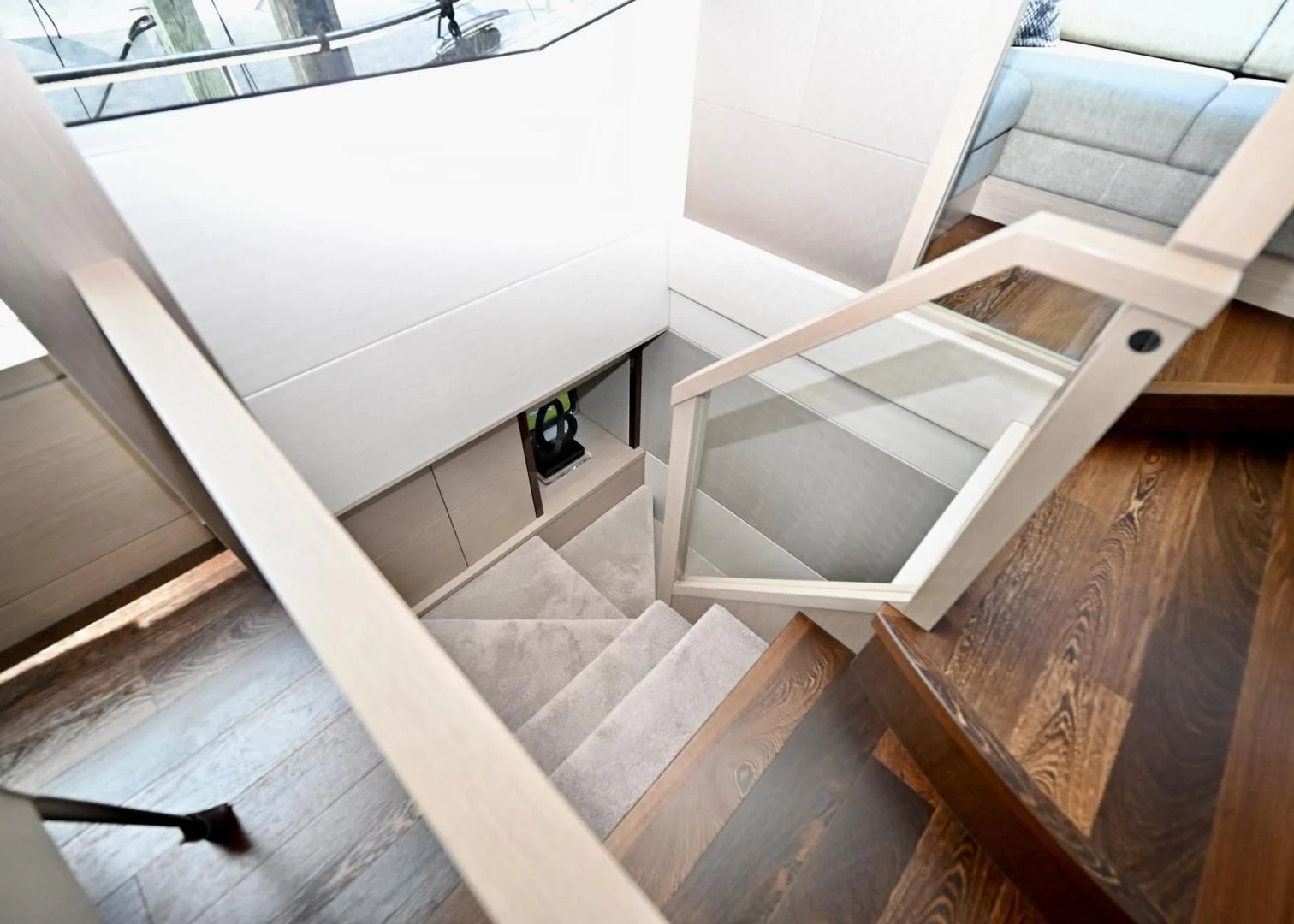 a wooden staircase with a railing aboard DO IT ANYWAY Yacht for Sale