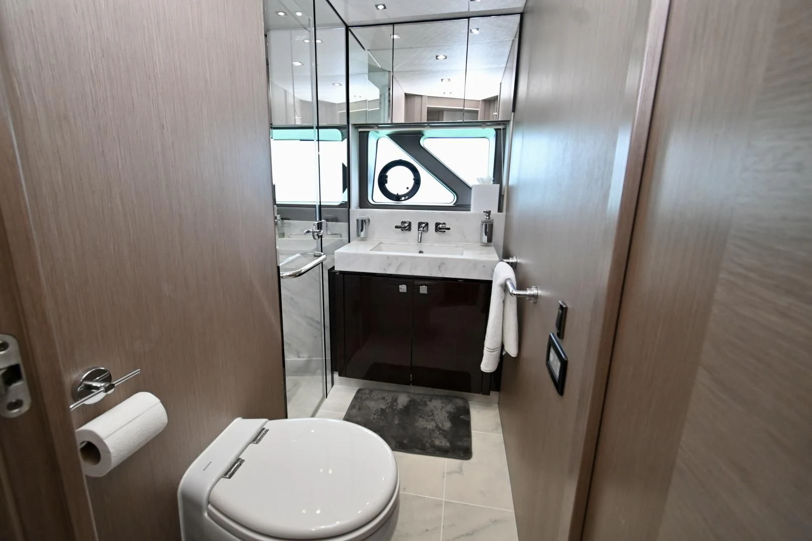 a bathroom with a toilet and a sink aboard DO IT ANYWAY Yacht for Sale