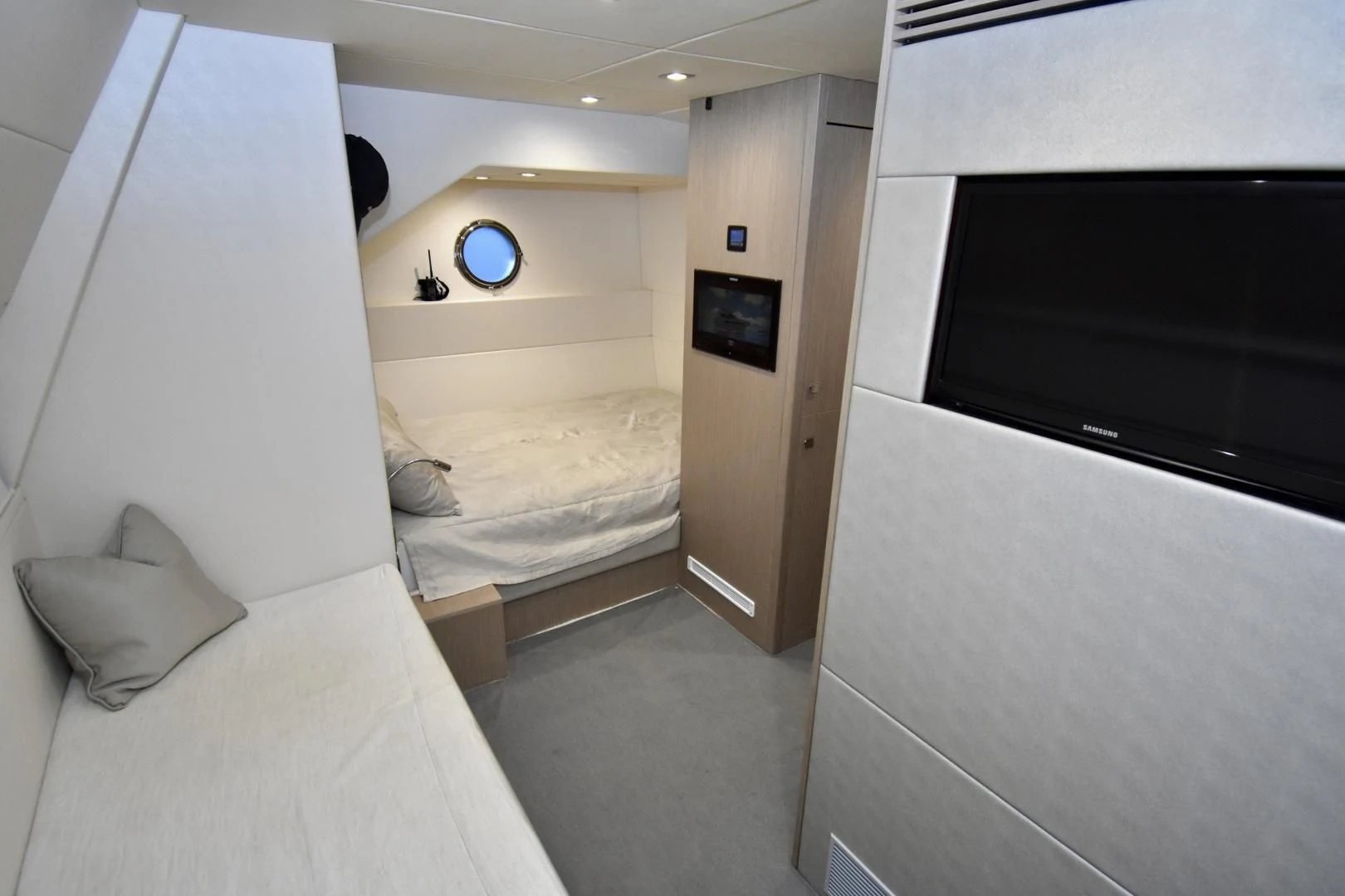 a room with a bed and a television aboard DO IT ANYWAY Yacht for Sale