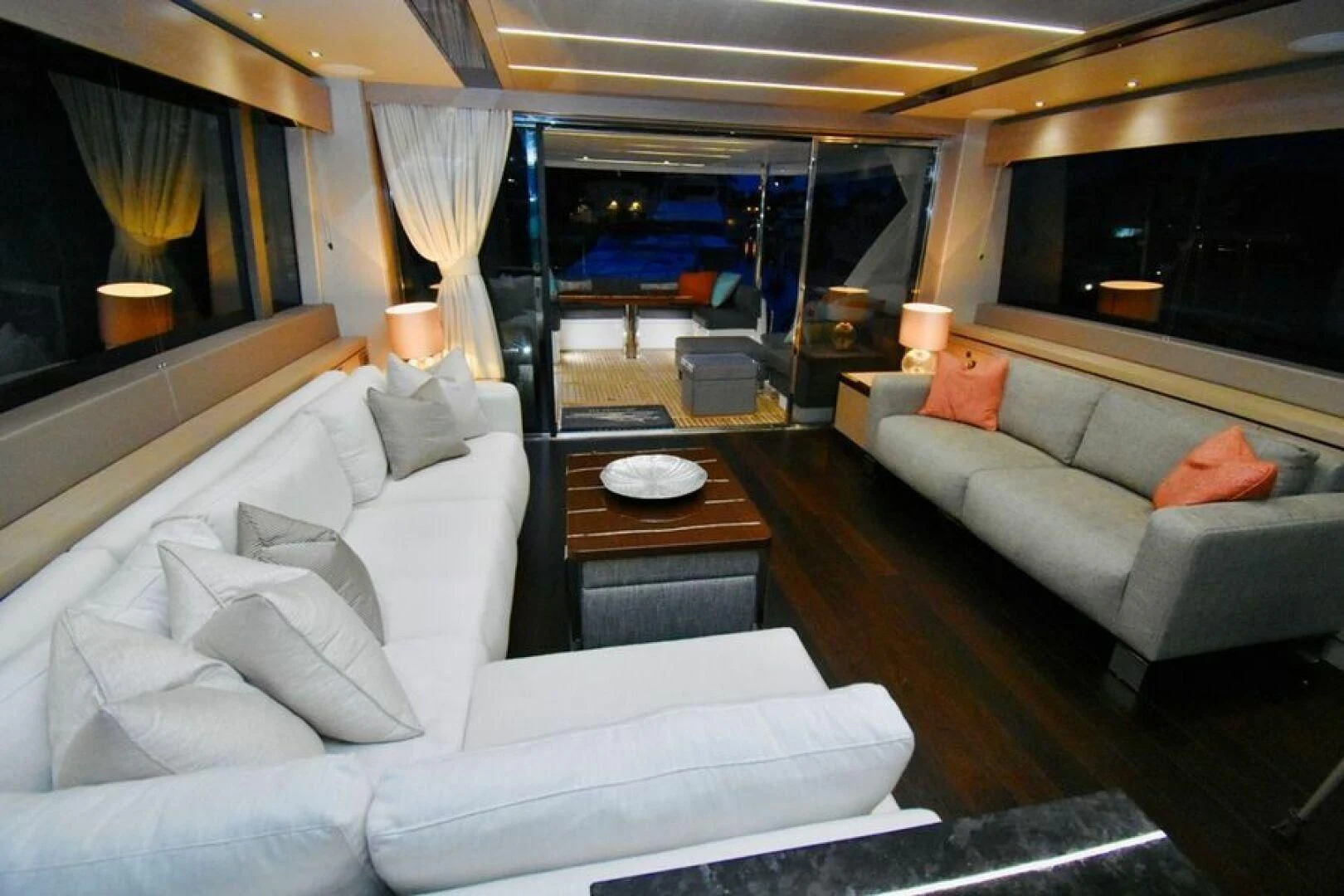 a living room with a couch and a coffee table aboard DO IT ANYWAY Yacht for Sale