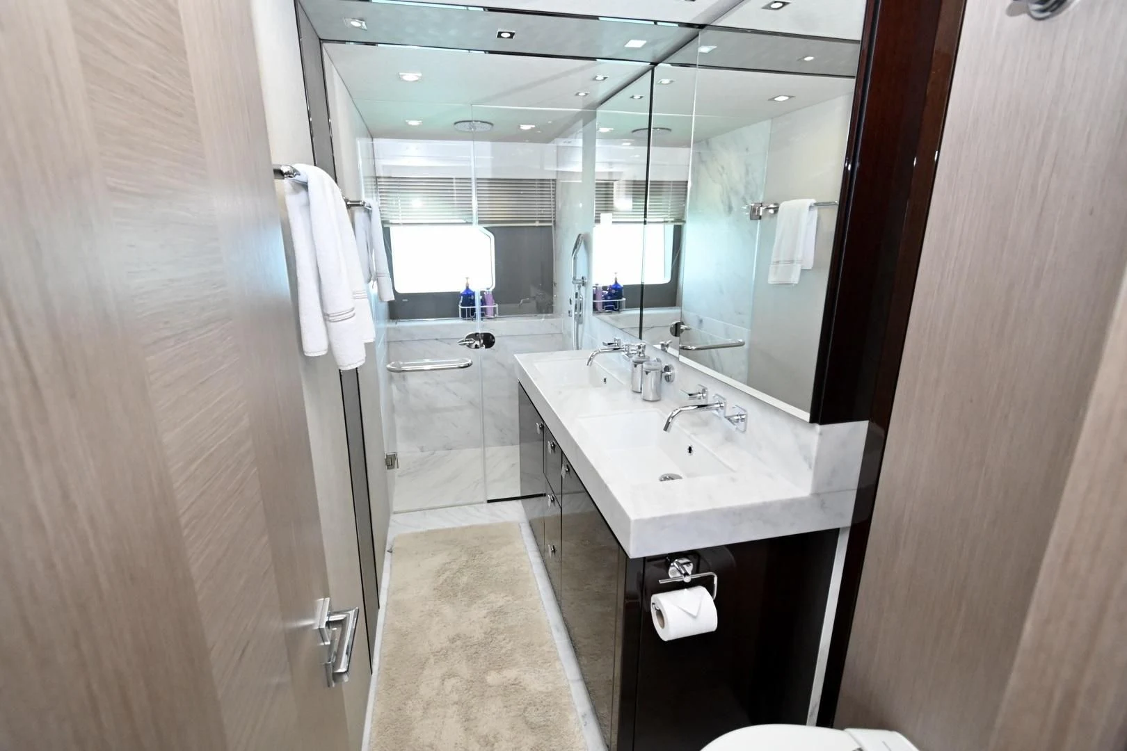 a bathroom with a sink and mirror aboard DO IT ANYWAY Yacht for Sale