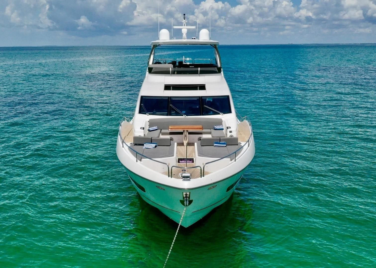 a white boat in the water aboard DO IT ANYWAY Yacht for Sale