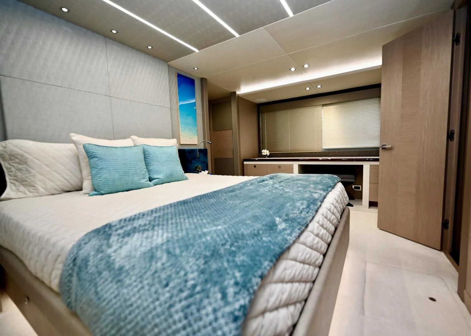 a room with a bed and a desk aboard DO IT ANYWAY Yacht for Sale