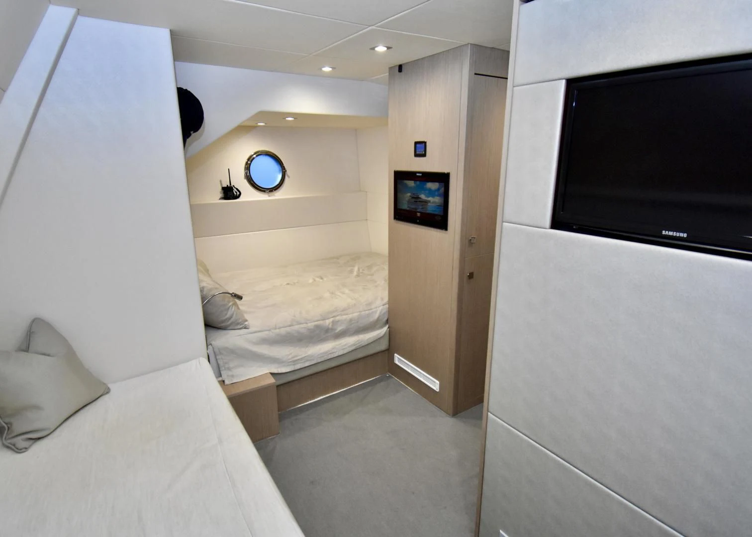a room with a bed and a television aboard DO IT ANYWAY Yacht for Sale