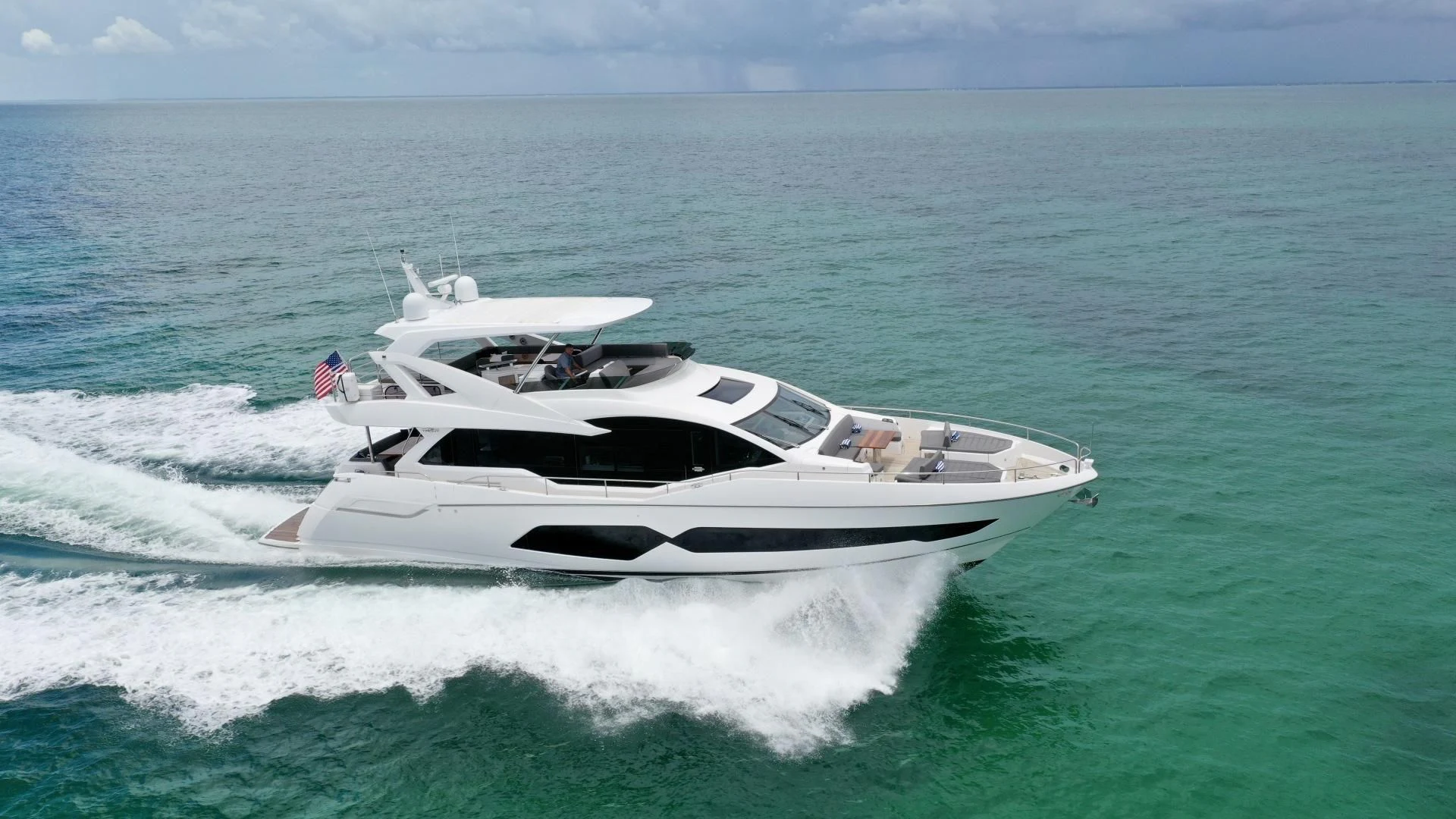 a white yacht in the ocean aboard DO IT ANYWAY Yacht for Sale