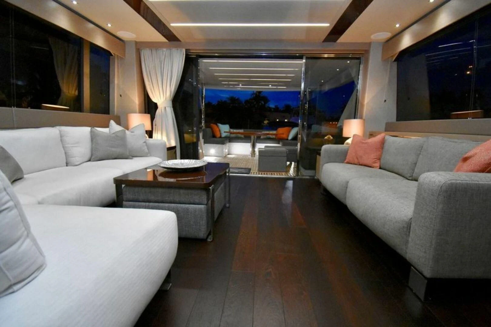 a living room with a large window aboard DO IT ANYWAY Yacht for Sale