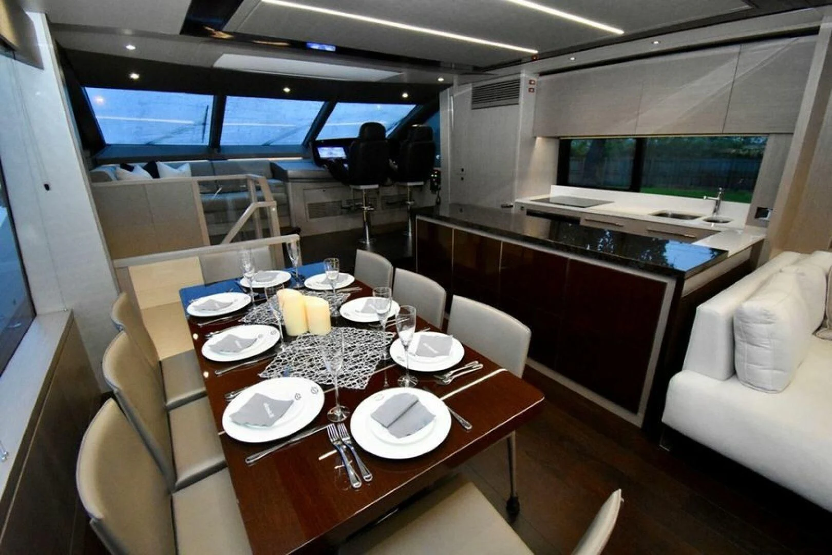 a table with plates and plates on it aboard DO IT ANYWAY Yacht for Sale