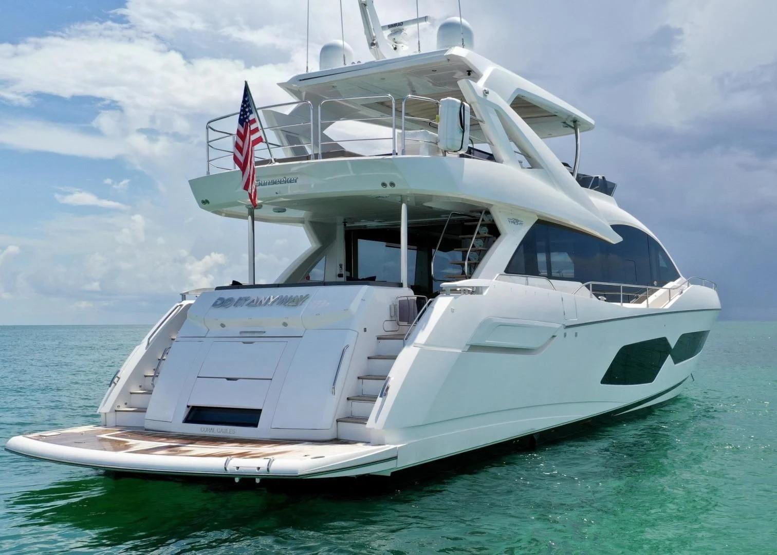 a white boat on the water aboard DO IT ANYWAY Yacht for Sale
