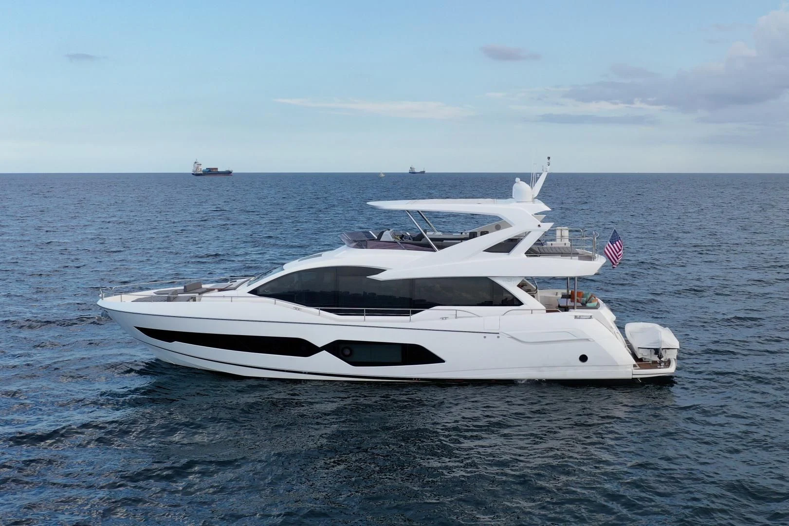 a white yacht in the water aboard DO IT ANYWAY Yacht for Sale