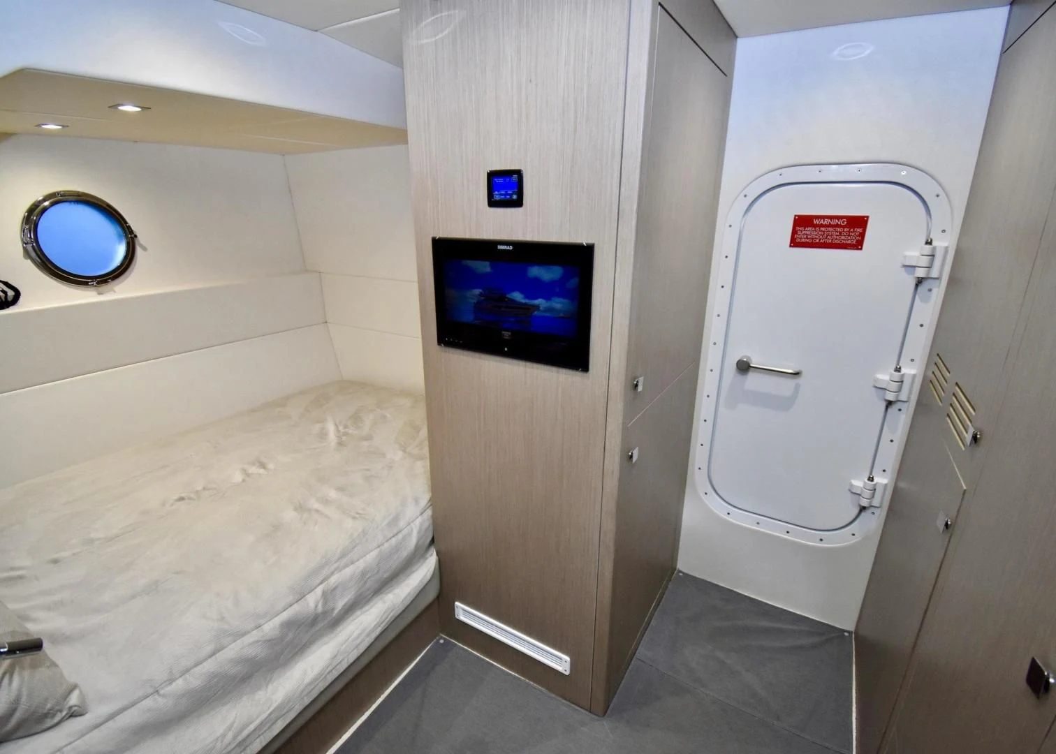 a small room with a bed and a tv aboard DO IT ANYWAY Yacht for Sale
