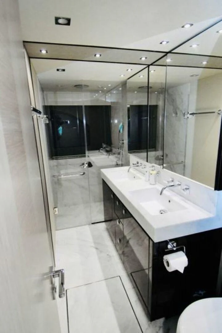 a bathroom with a sink and a mirror aboard DO IT ANYWAY Yacht for Sale