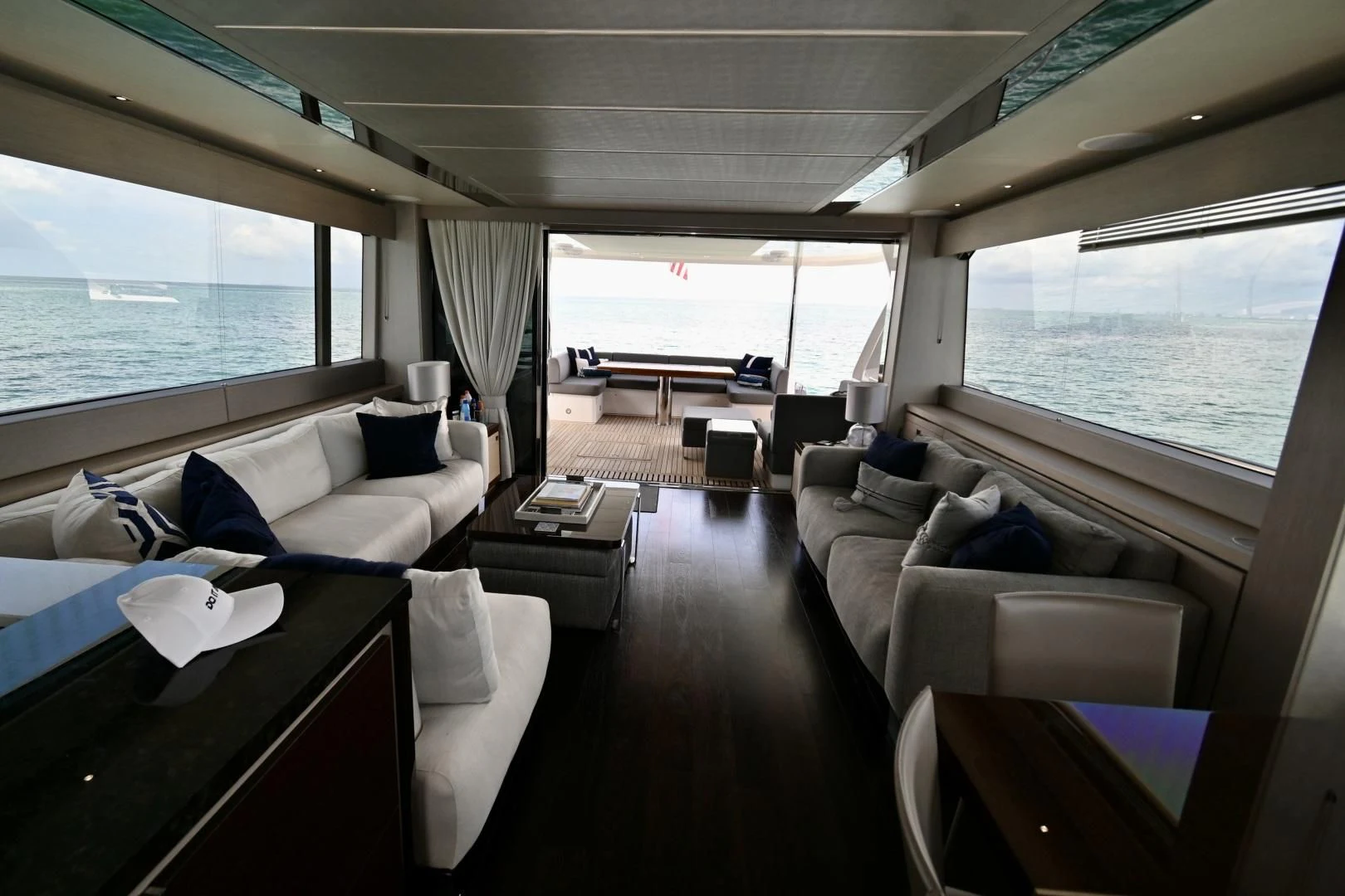 a living room with a large window aboard DO IT ANYWAY Yacht for Sale