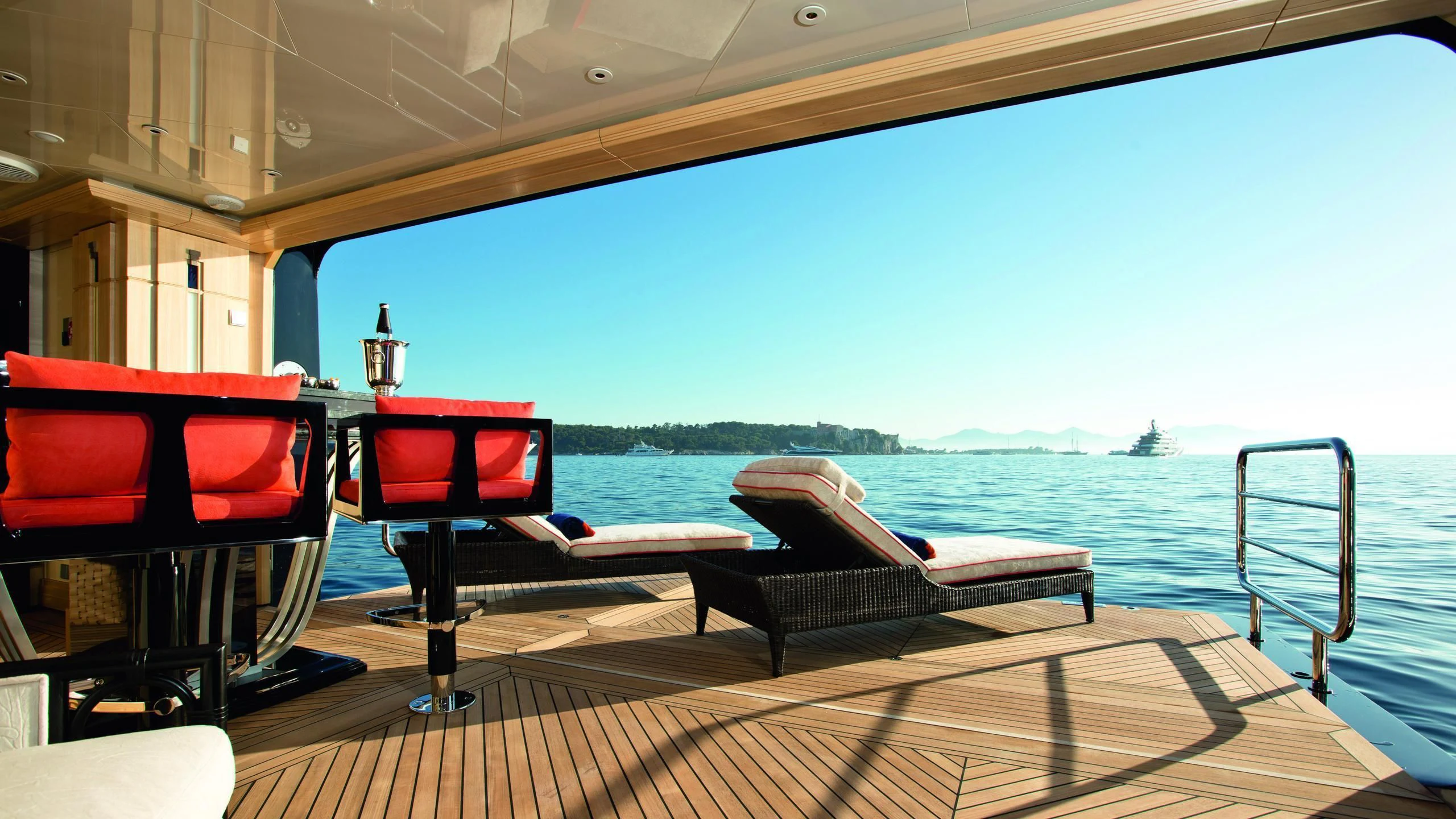 a deck with chairs and a table on it aboard ARIENCE Yacht for Sale