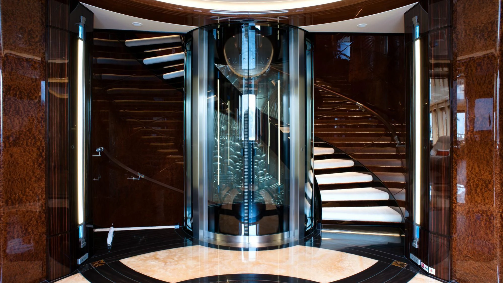 a hallway with glass doors aboard ARIENCE Yacht for Sale