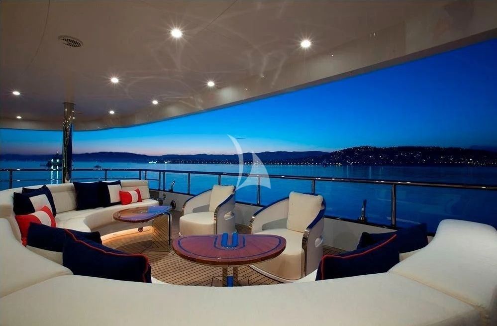 a large lounge area with a large pool and a large city landscape aboard ARIENCE Yacht for Sale