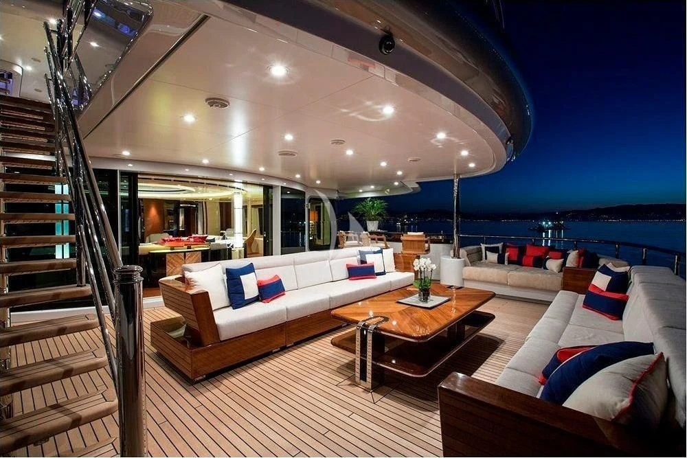 a modern looking living room with a large balcony overlooking the ocean aboard ARIENCE Yacht for Sale