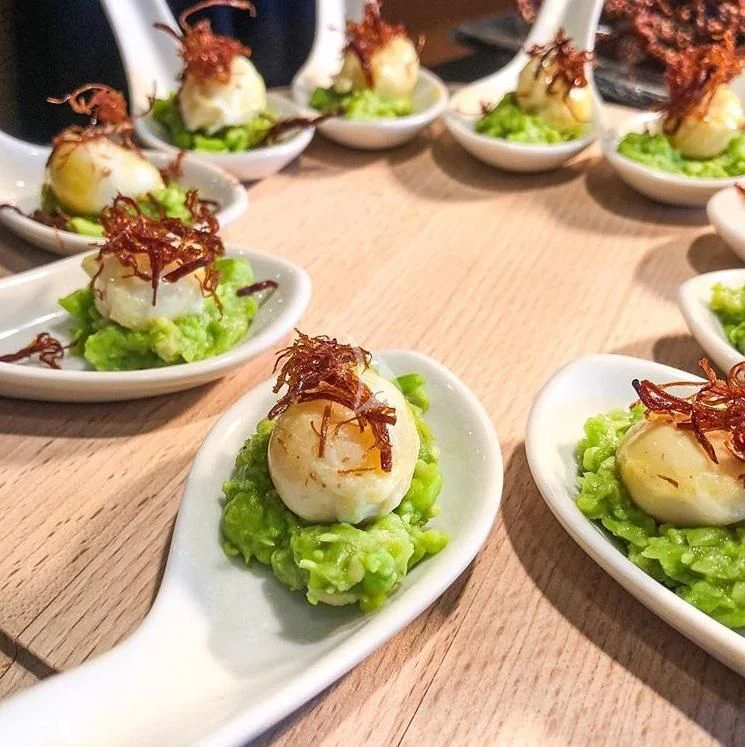 a table full of plates of food aboard ARIENCE Yacht for Sale